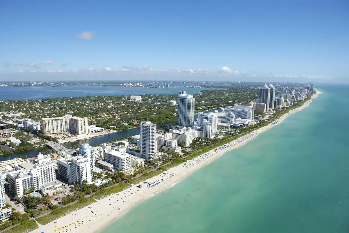 Aerial view of Miami Beach with turquoise water and hotels